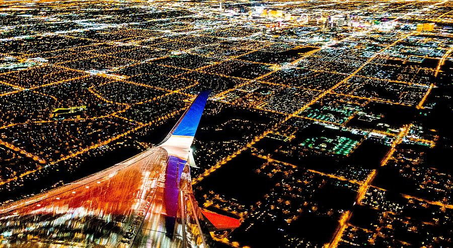 Las Vegas City lights from airplane at night Photograph by Alex Grichenko