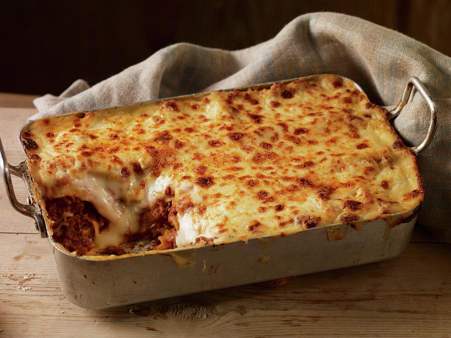 Lasagne In A Baking Dish, One Slice Removed Photograph by Atkinson ...