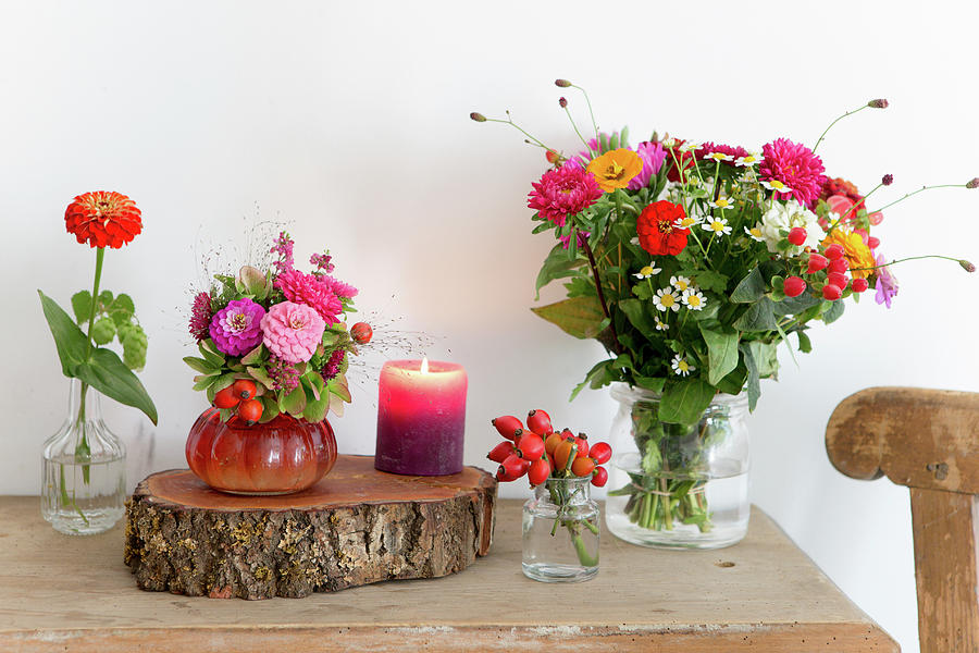 Late Summer Bouquets, Log Board And Candle On Wooden Table Photograph by Iris Wolf