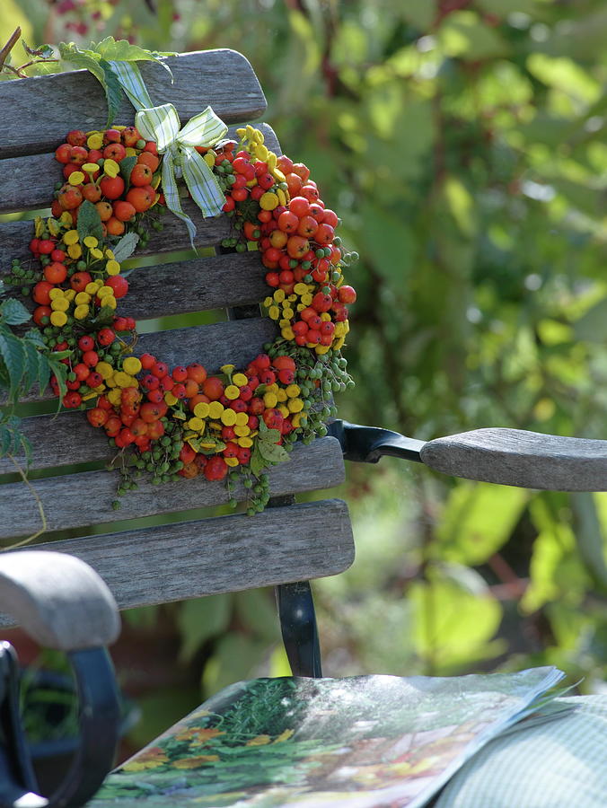 Late Summer Wreath Of Wild Fruits And Tansy Photograph by Friedrich Strauss