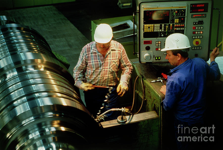 Lathe Operators Machining A Turbine Shaft. Photograph by Rosenfeld Images Ltd/science Photo Library