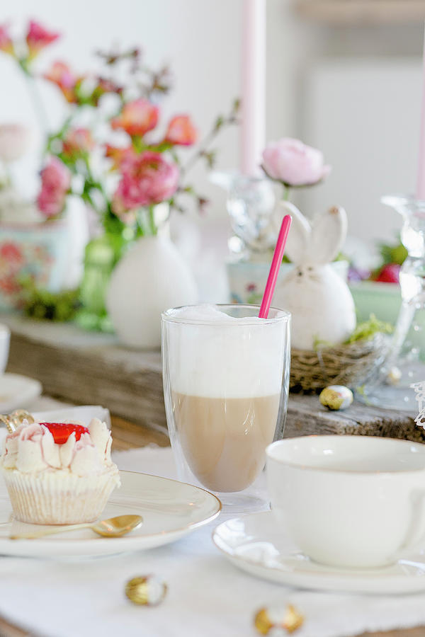 Latte Macchiato And A Cupcake On A Table Laid For Easter Photograph by Christel Harnisch