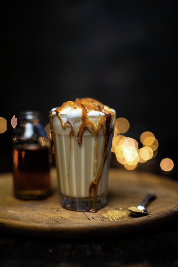 Latte Macchiato With Milk Foam And Caramel Syrup Photograph by Lucy Parissi