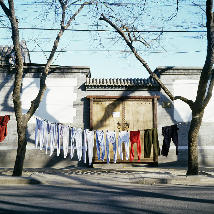 Laundry Drying On Clotheslines In Street Photograph by Jason Hosking