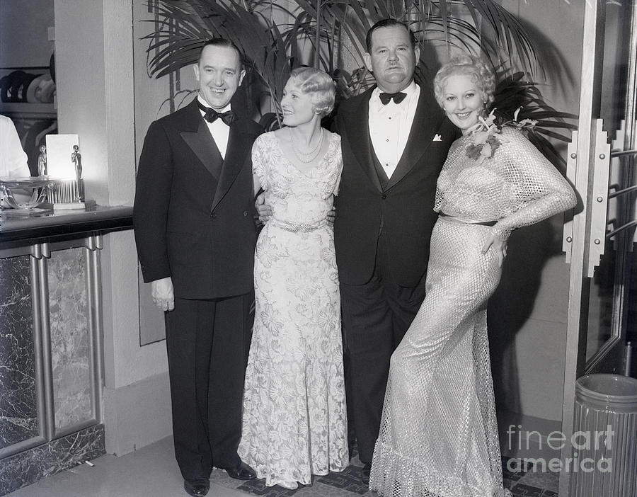 Laurel And Hardy With Women Photograph by Bettmann