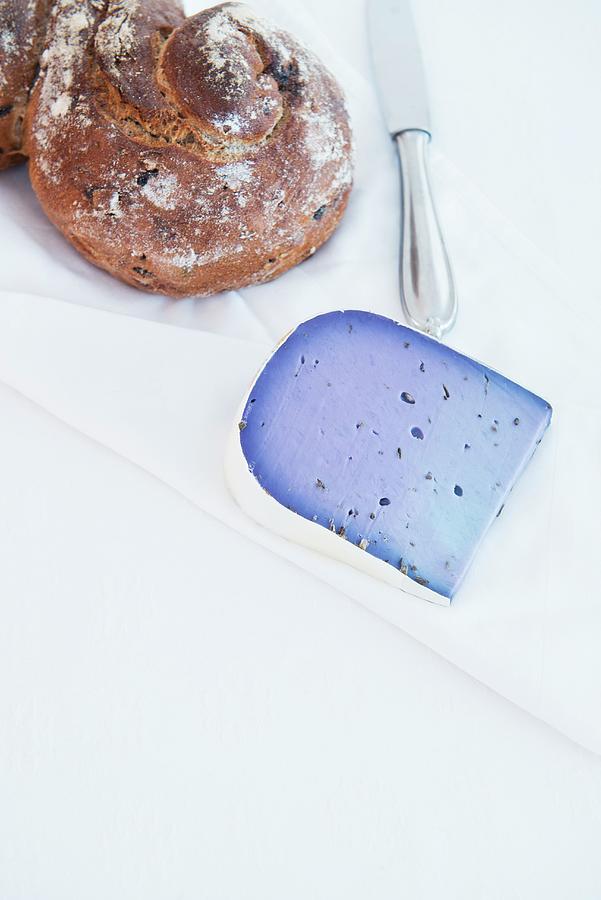 Lavender Gouda And Crusty Bread On A White Tablecloth Photograph by Angelika Grossmann