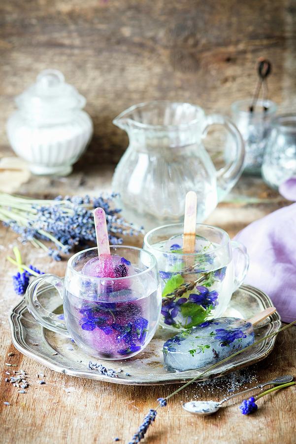 Lavender Lemonade Ice Lollies Served In Glasses Of Water Photograph by Irina Meliukh