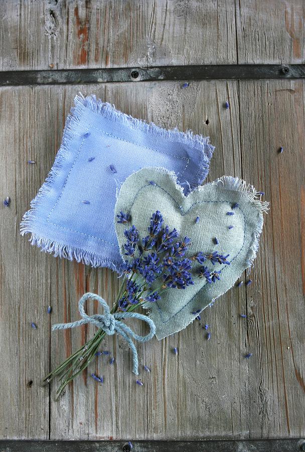 Lavender Posy Tied With Bow Lying On Two Handmade Lavender Bags Photograph by Regina Hippel