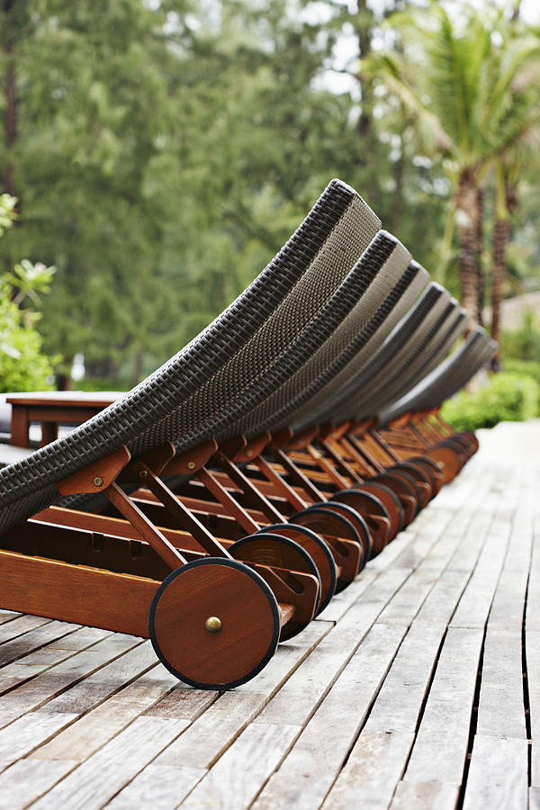 Furniture Digital Art - Lawn Chairs Lined Up On Wooden Deck by Niels Busch