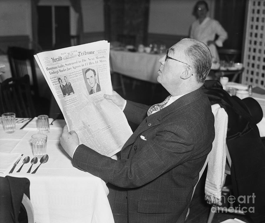 Lawyer Reading Newspaper Photograph by Bettmann