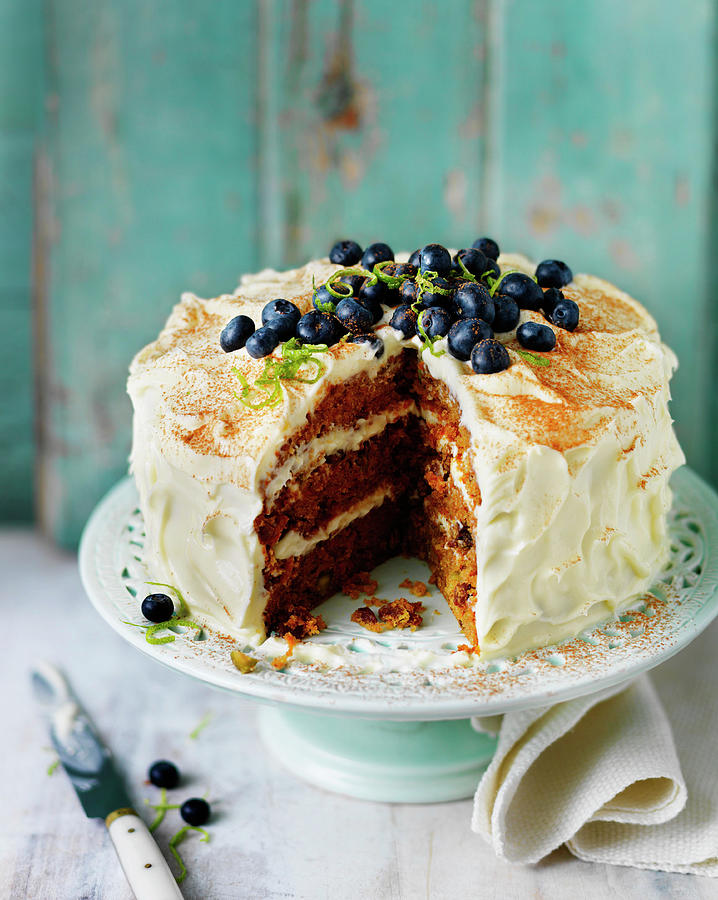 Layered Carrot Cake With Buttercream Icing And Blueberries Photograph by Karen Thomas