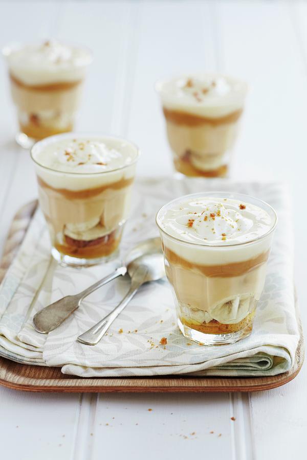 Layered Deserts With Caramel Cream, Bananas And Creamy Yoghurt Photograph by Charlotte Tolhurst