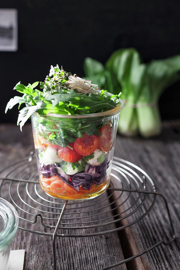 Layered Salad With Rocket, Tomato, Carrot, Mustard Cress, Red Cabbage, Mozzarella, Parsley And Pak Choi In A Glass Jar Photograph by Pia Simon