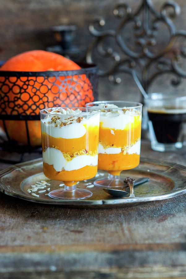 Layred Dessert With Pumpkin Puree, Yoghurt And Muesli In Two Glasses Photograph by Irina Meliukh