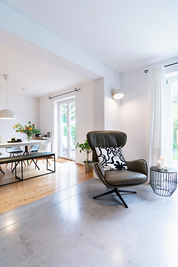 Leather Armchair In Bright Living Room With View Into Dining Room Photograph by Alexandra Dost