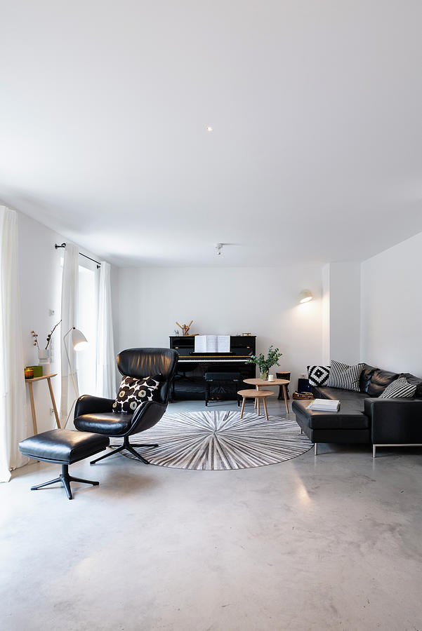 Leather Armchair, Piano And Sofa In Living Room With Screed Floor Photograph by Alexandra Dost