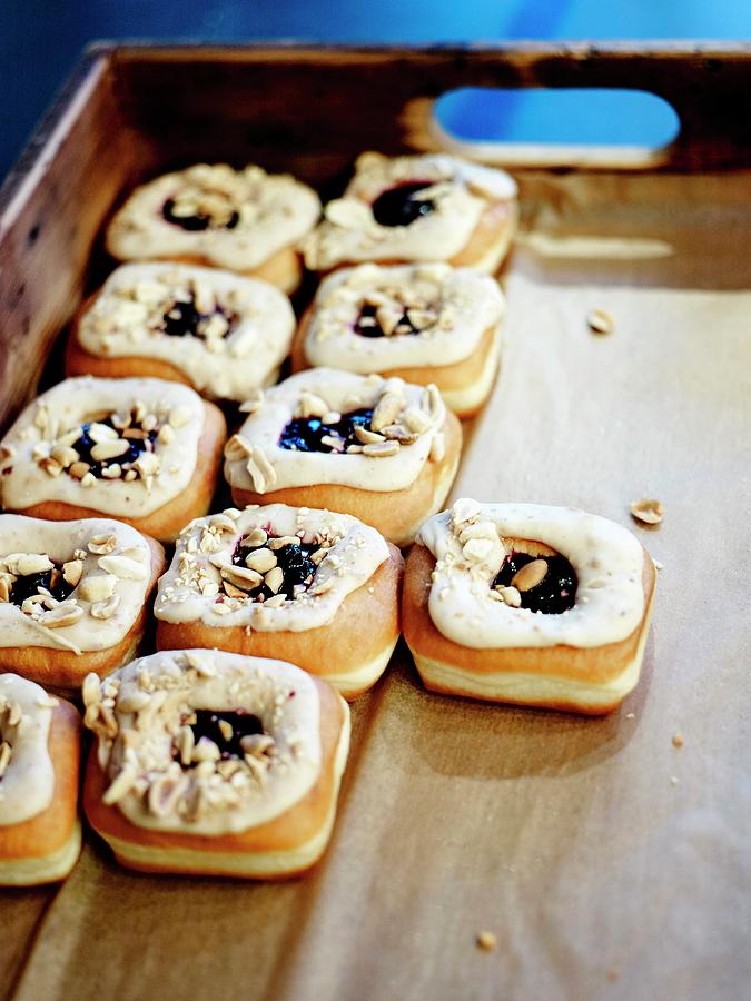Leavened Donuts With Blackcurrant Jam Center And Crosstown Peanut Butter Frosting Photograph by Amiel