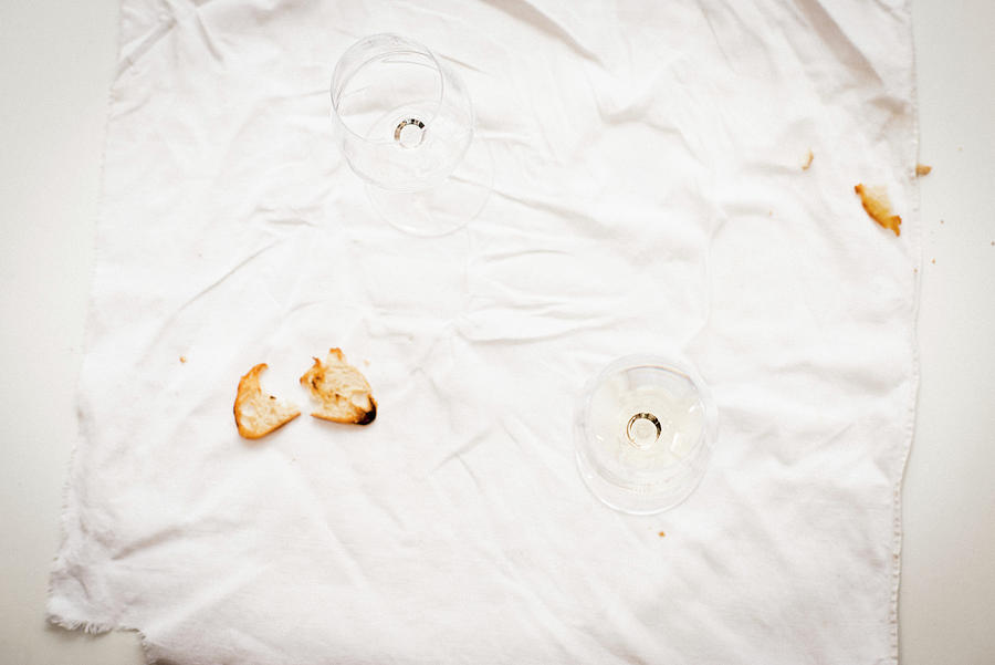 Leftover Bread Crisps And Empty Wine Glasses On A White Cloth Photograph by Manuela Rther