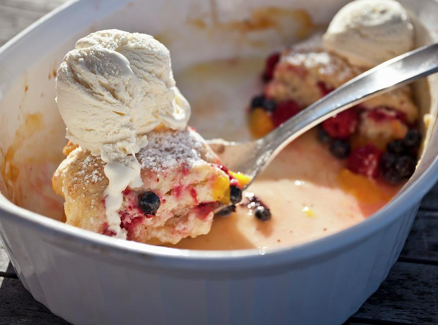 Leftover Raspberry, Blueberry And Peach Cobbler With Vanilla Ice Cream Photograph by Ryla Campbell