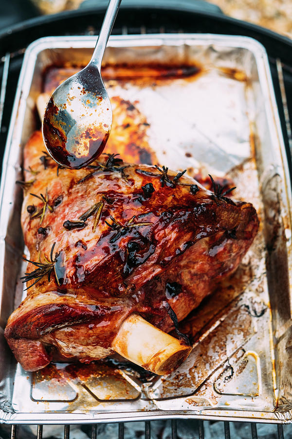 Leg Of Lamb Cooked On A Bbq Photograph by Adrian Britton