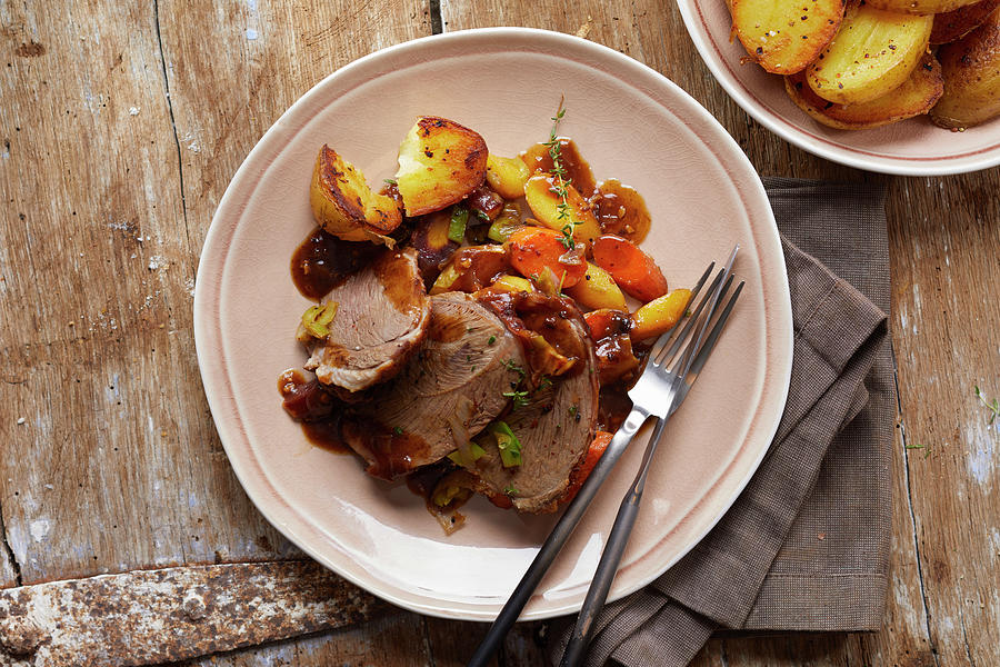 Leg Of Lamb With Potatoes And Vegetables Photograph by Frank Weymann