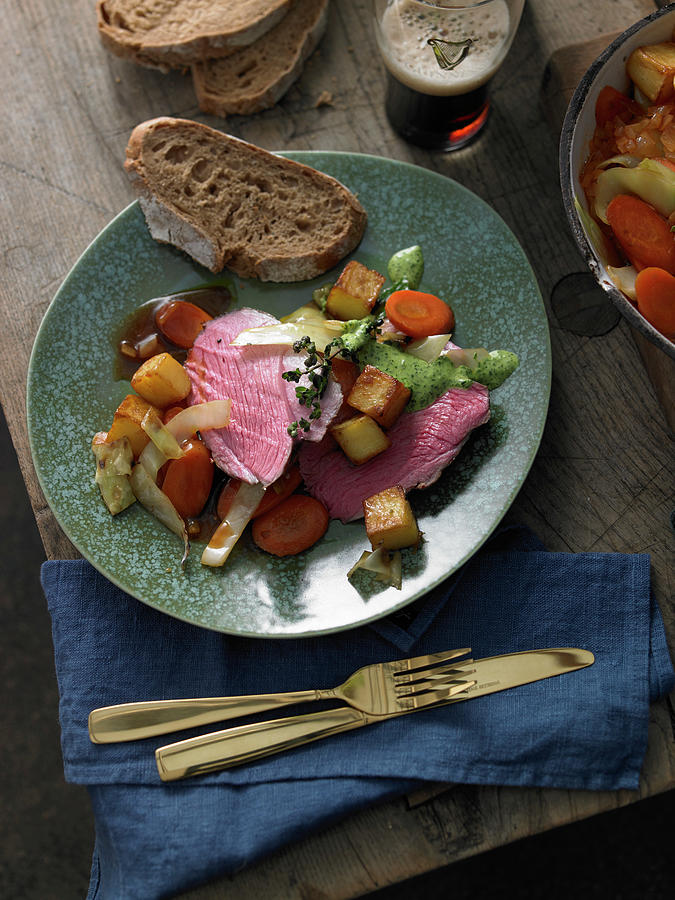 Leg Of Lamb With Vegetable Stew And Diced Potatoes Photograph by Jan-peter Westermann