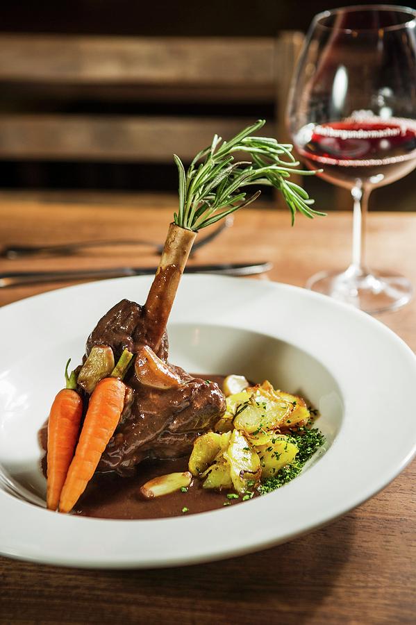 Leg Of Venison With Roast Potatoes And Carrots Photograph by Rita Newman