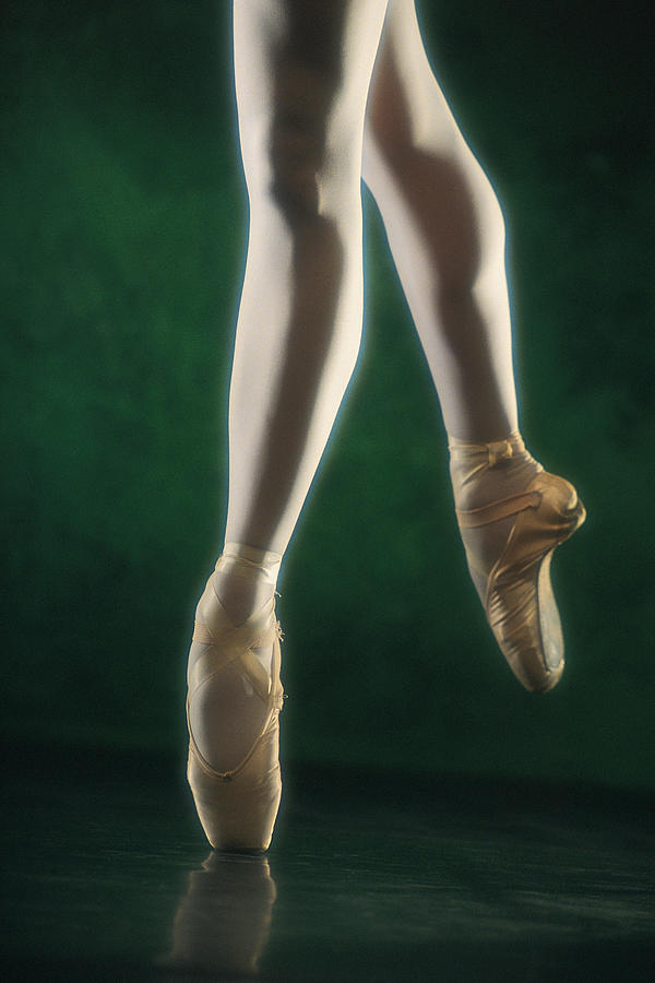 Of A Ballerina Balancing On by Comstock