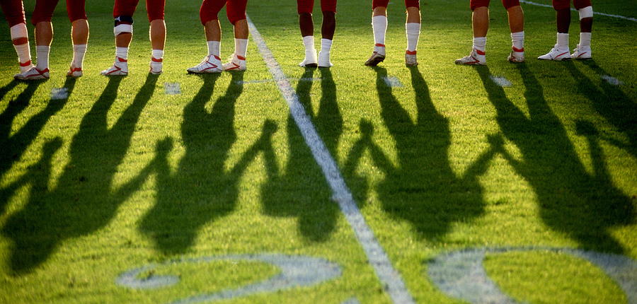 Legs Of American Football Players On Photograph by David Madison