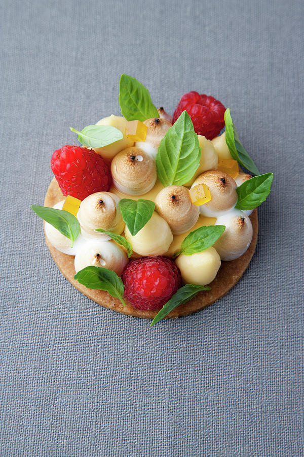 Lemon And Basil Tart With Raspberries Photograph by Michael Wissing