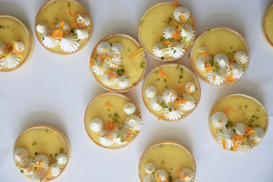 Lemon And Passion Fruit Cakes With Meringue Dots And Flower Petals Photograph by So Schmeckt Liebe