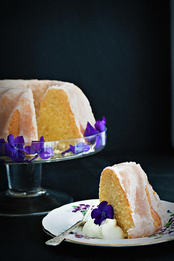 Lemon Bundt Cake Decorated With Violets, Sliced Photograph by The Food Union