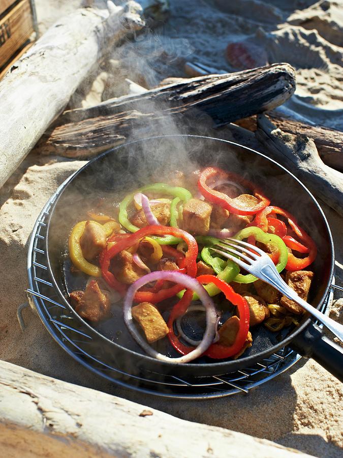Lemon Chicken With Pepper In A Pan On A Barbecue On A Beach Photograph by Hannah Kompanik