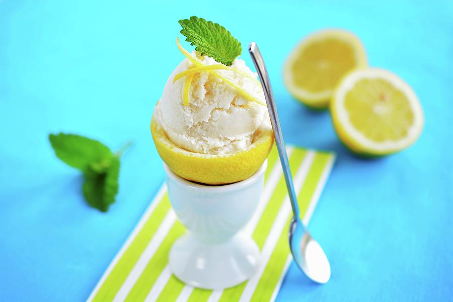 Lemon Ice Cream Served In A Hollowed Out Lemon In An Egg Cup Photograph by Mariola Streim
