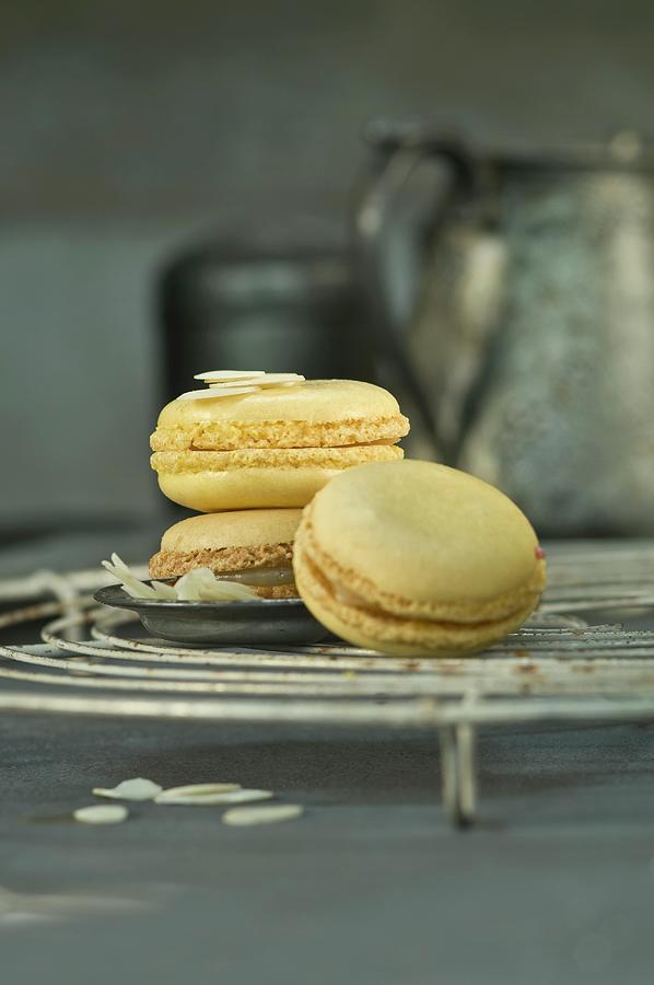Lemon Macaroons With Flaked Almonds On A Wire Rack Photograph by Achim Sass