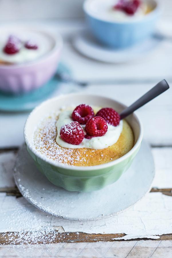 Lemon Pudding With Raspberries Photograph by Hein Van Tonder