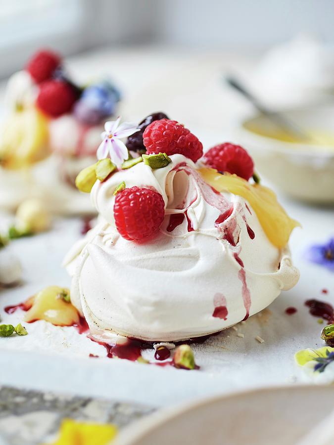 Lemon, Raspberry, Pistachio Meringue With Lemon Curd, Poached Raspberries, And Vanilla Cream, Edible Flowers Photograph by Lukejalbert
