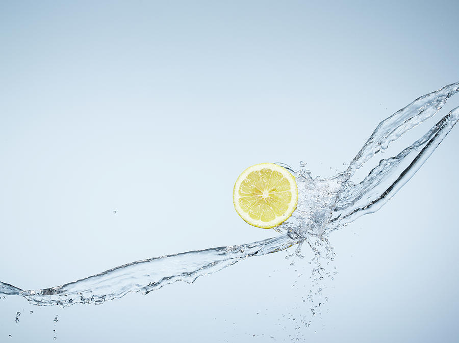 Lemon Slice And A Water Splash Photograph by Chris Stein