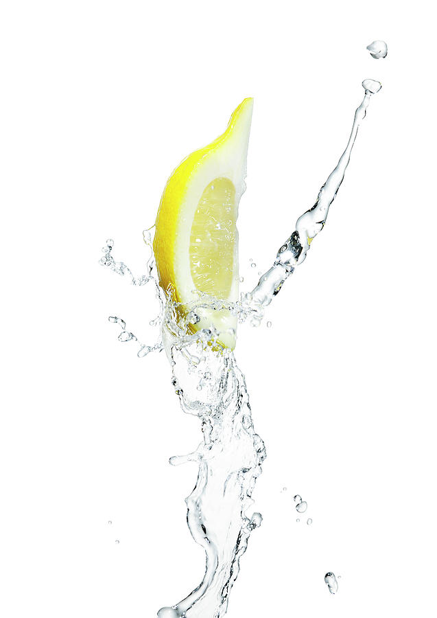 Lemon Slice With A Splash Of Water Photograph by Chris Stein