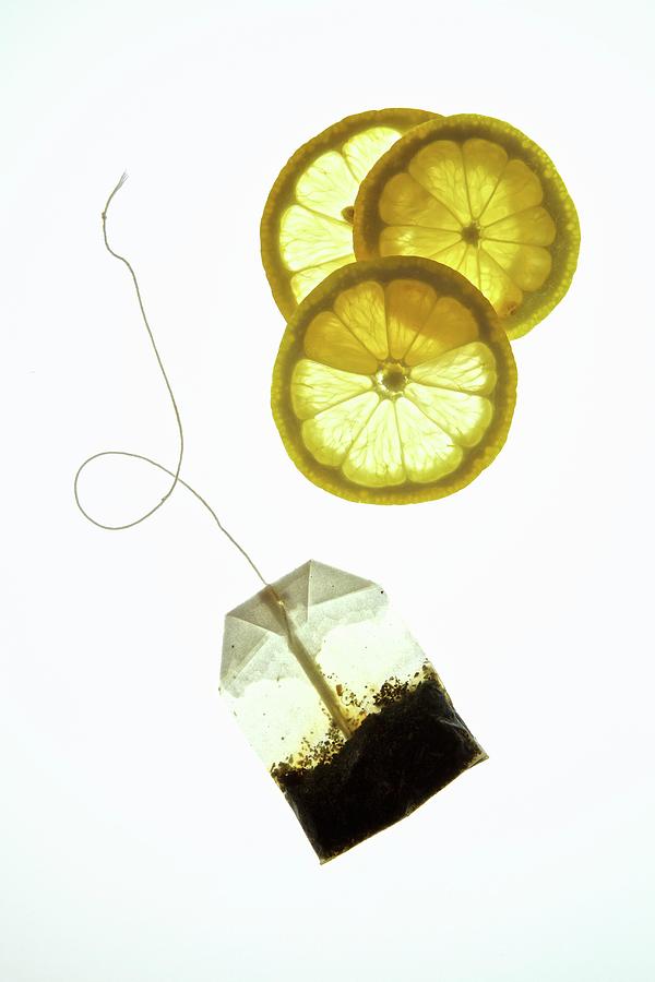 Lemon Slices And A Tea Bag Photograph by Andre Baranowski