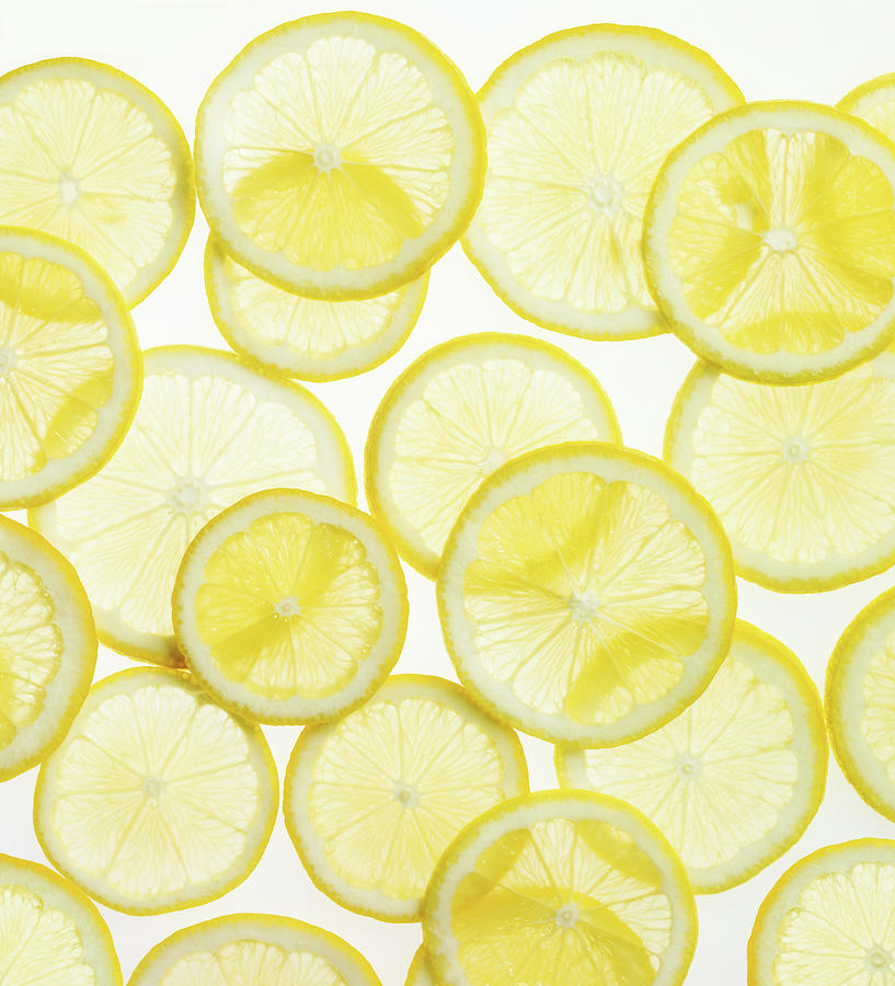 Still Life Photograph - Lemon Slices Arranged In Pattern by Lauren Burke