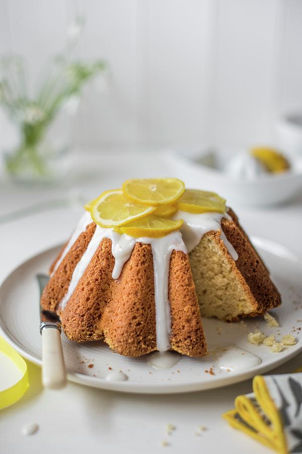 Lemon Sponge Cake With Lemon Icing And Fresh Lemon Slices, Slice Removed Photograph by Magdalena Hendey