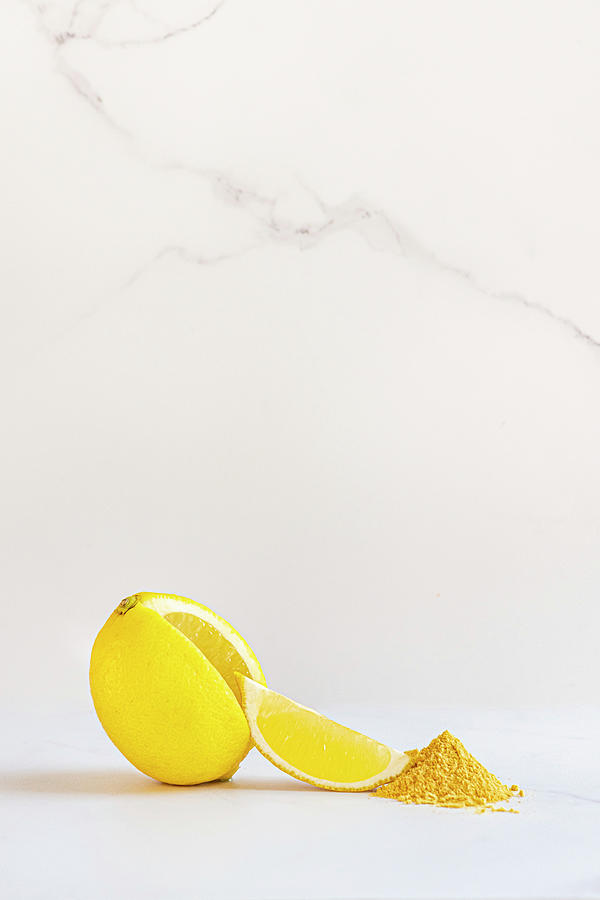 Lemon With Wedge And Lemon Fruit Powder Photograph by Hein Van Tonder