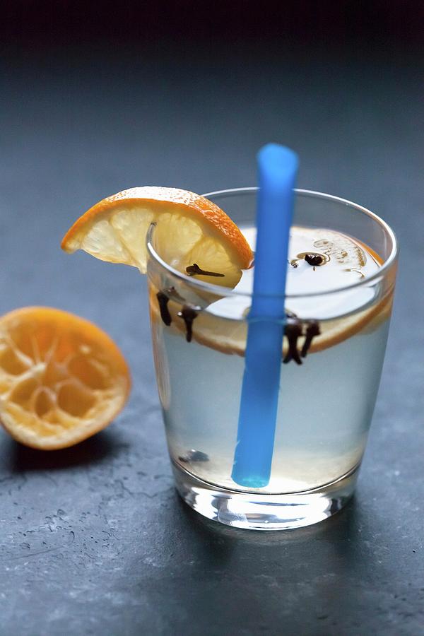 Lemonade In A Glass With Orange Slices Photograph by Sonya Baby