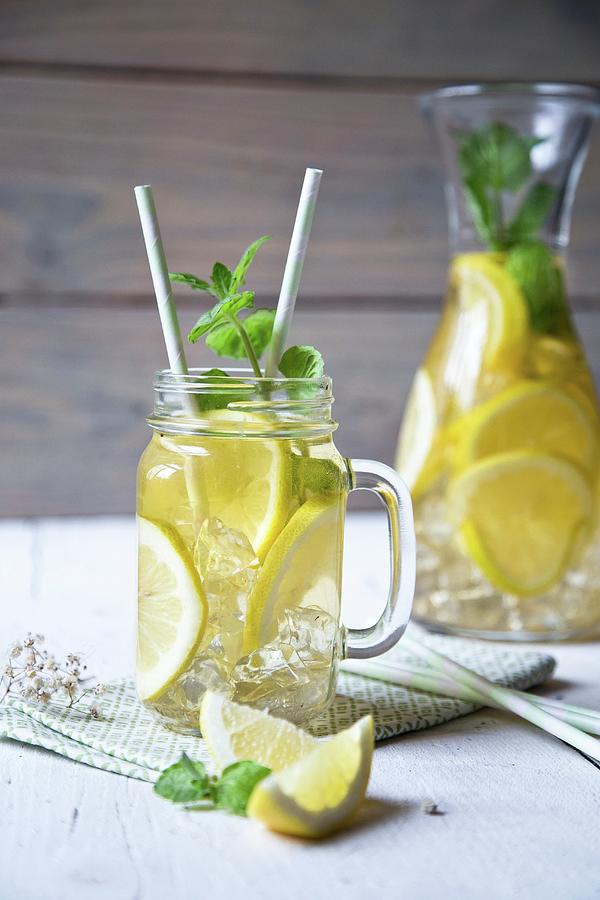 Lemonade With Ice Cubes And Mint Photograph by Denise Rene Schuster
