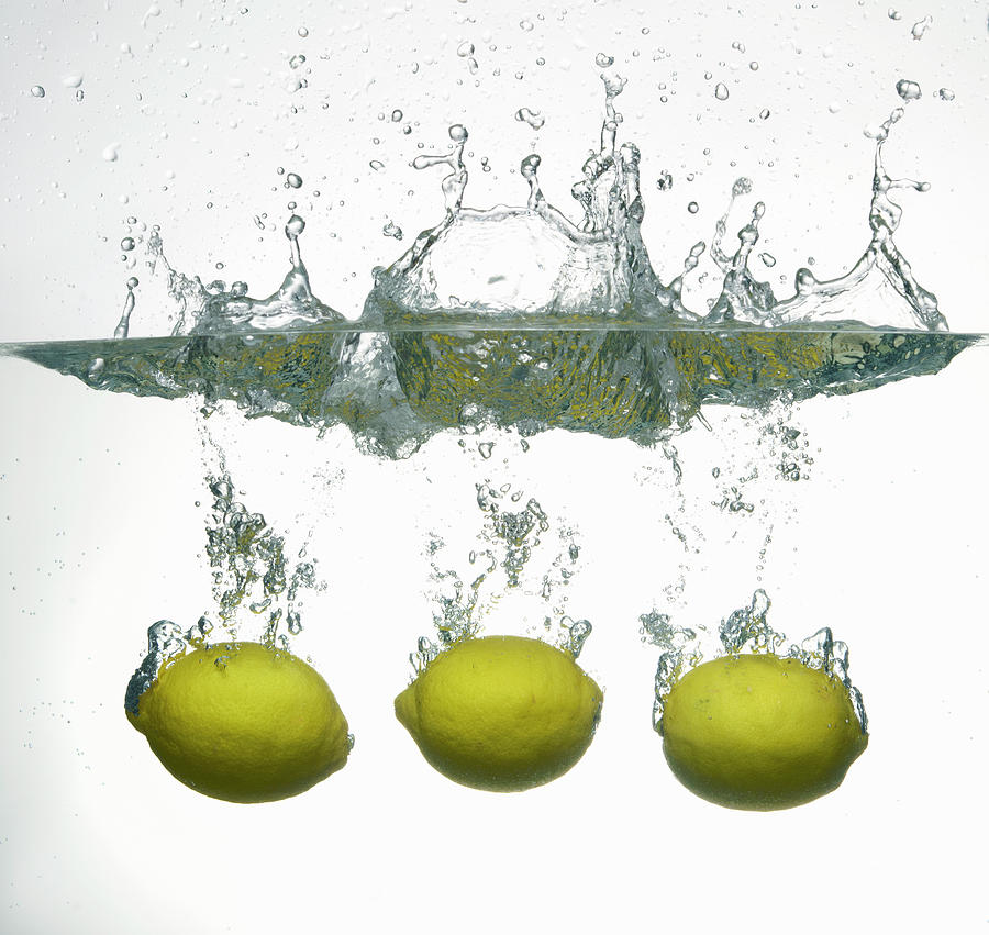 Lemons Sinking In Water Photograph by Buena Vista Images