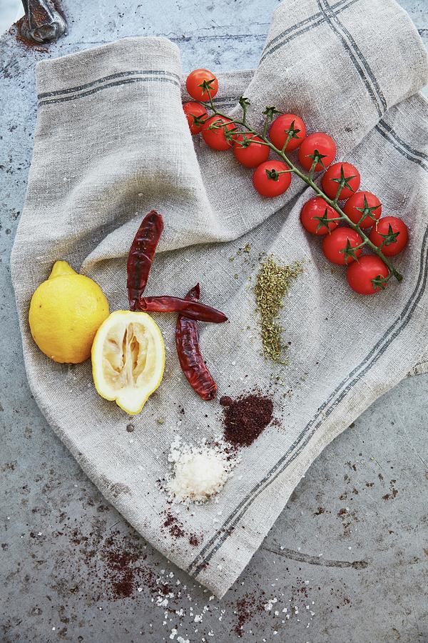 Lemons, Tomatoes, Chillies, And Spices On A Linen Cloth Photograph by Liv Friis