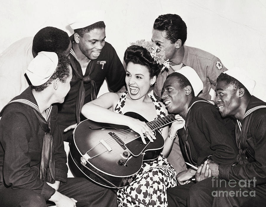 Lena Horne Playing Guitar For Servicemen Photograph by Bettmann