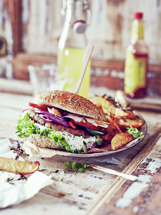 Lentil Burgers With Rosemary Potato Wedges Photograph by Thorsten Kleine Holthaus