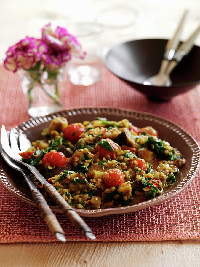 Lentil Curry With Spinach, Aubergines And Tomatoes Photograph by Gareth Morgans